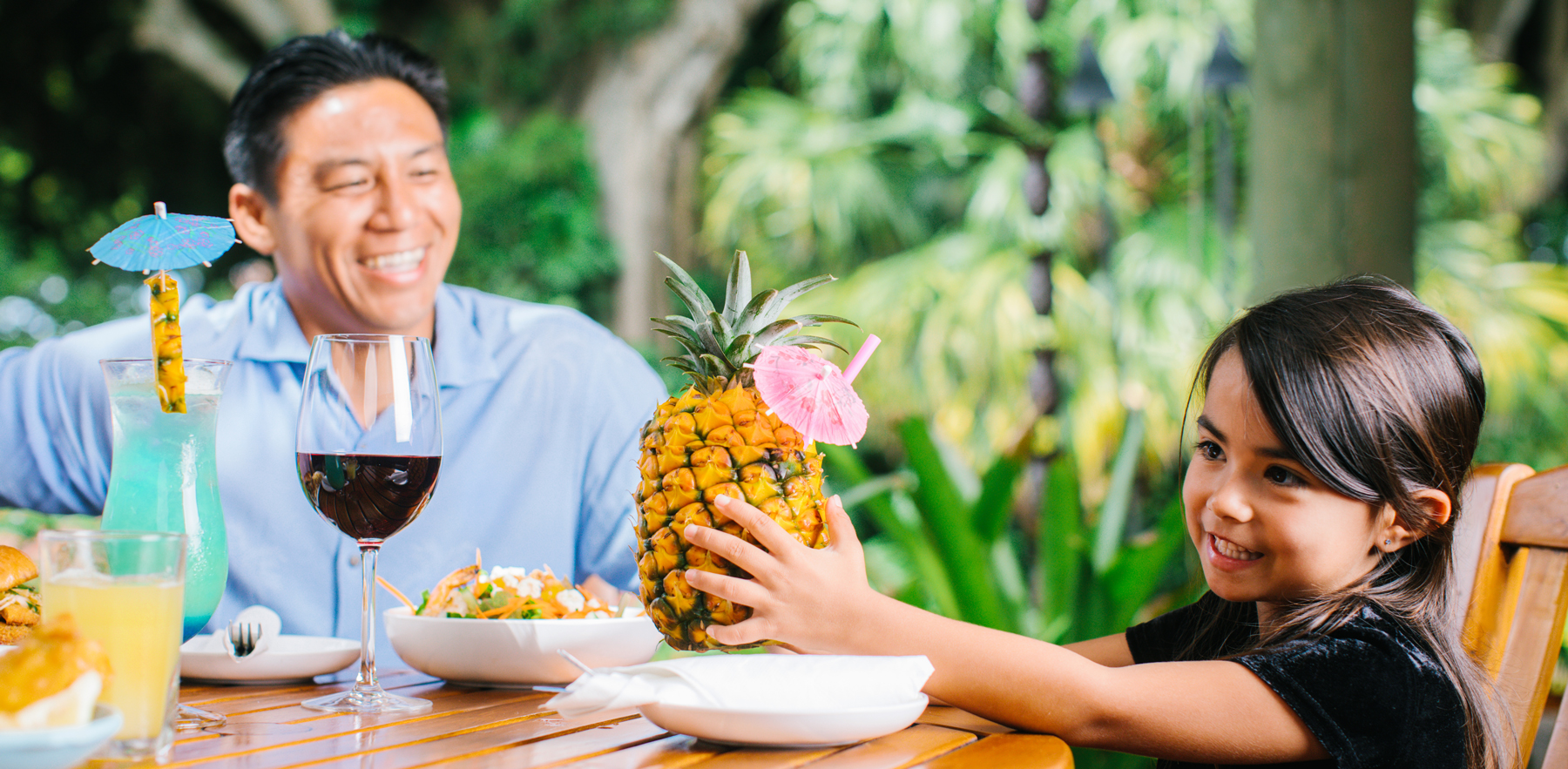 A daughter and her dad enjoying a meal